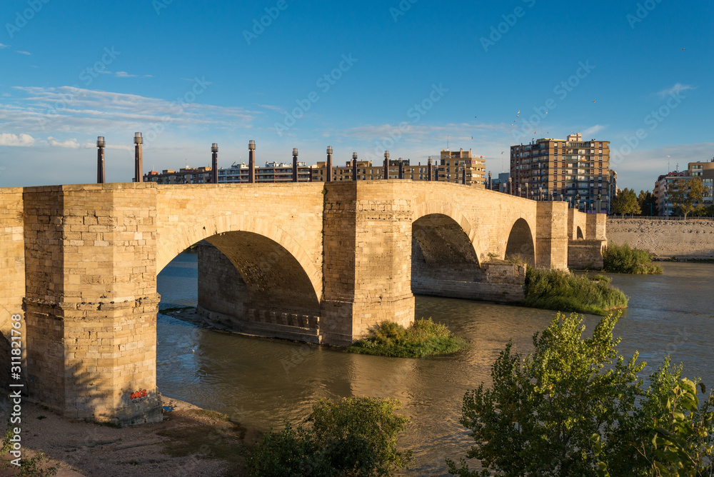 Puente de Piedra or bridge of lions across the river Ebro in the Spanish city Zaragoza