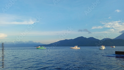  sped boat and pual island background