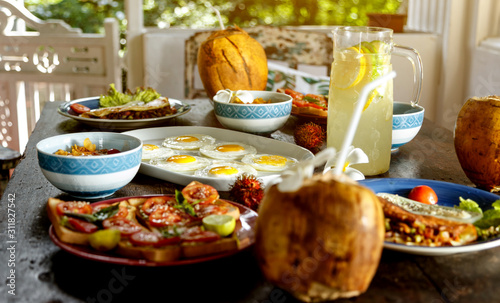 simple healthy food on an old wooden table, serving with simple dishes, natural lemonade.