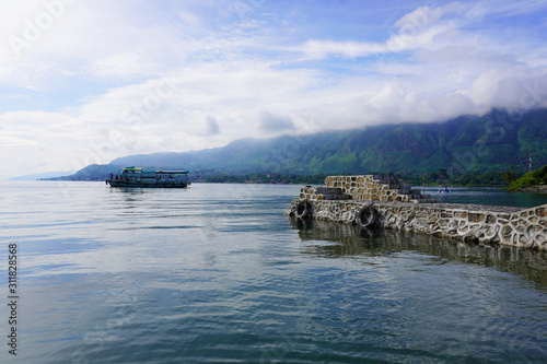 Ferry is the major transport to travel around the island of Lake Toba.  photo