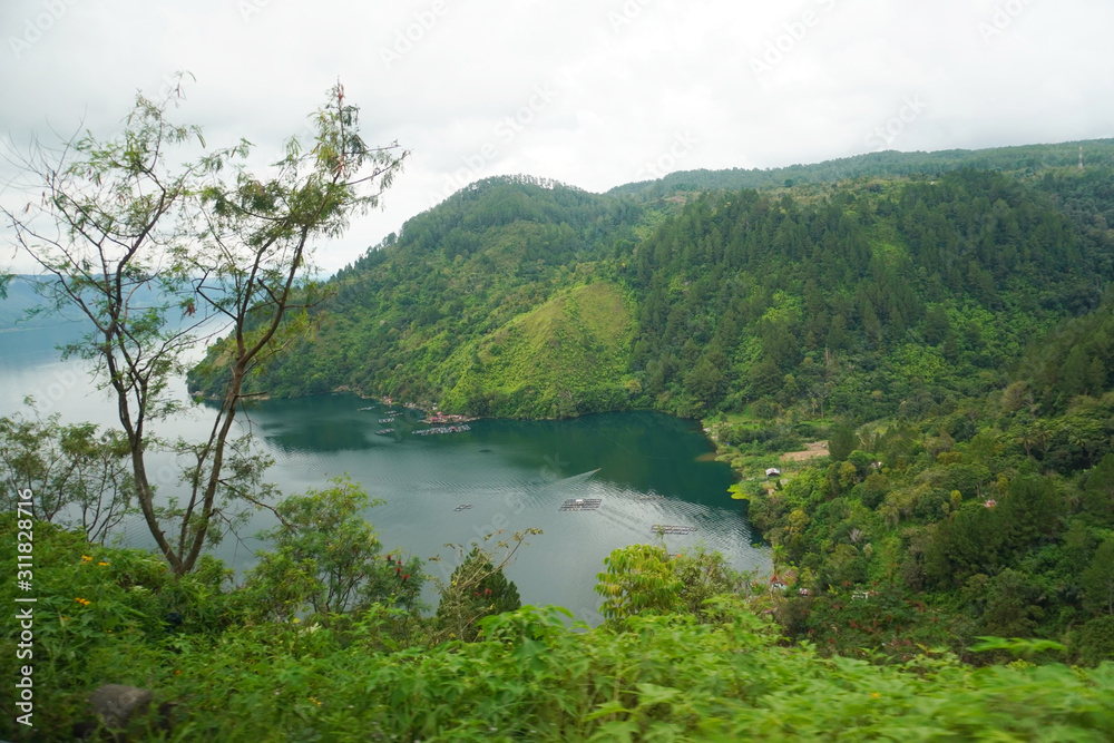Samosir Island, is a large volcanic island in Lake Toba            