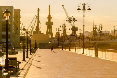 Tsesarevich Nicolay Embankment in Vladivostok. Walking area by the sea at dawn. photo