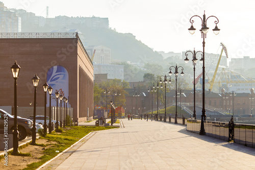 Tsesarevich Nicolay Embankment in Vladivostok. Walking area by the sea at dawn. photo