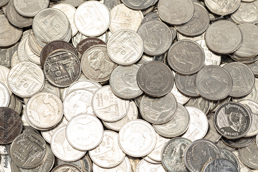 A group of Thai 1 Baht coin with two side display on the floor A group of Thai 1 Baht coin with two side display on the floor