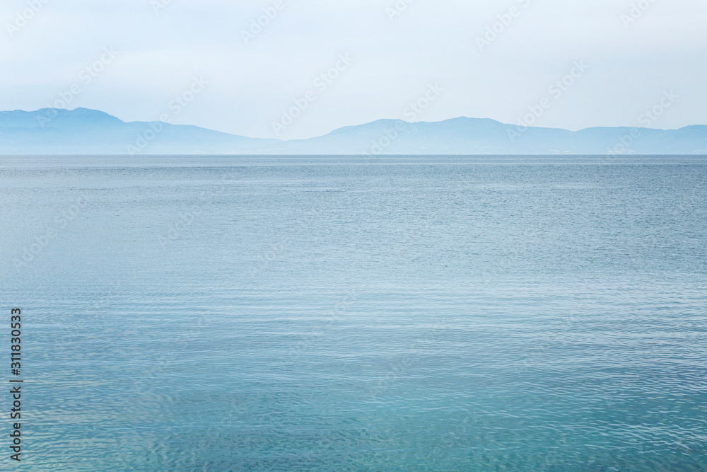 Calm blue sea and skyline. Beautiful landscape. Space for text. Background.