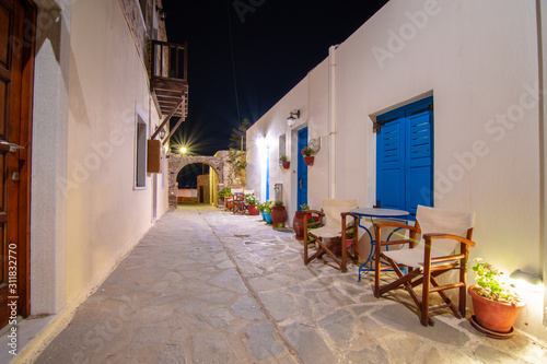 Narrow neighborhood streets and buildings at the old Chora  Naxos island  Greece.