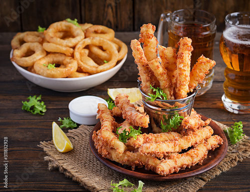 Canvas Print Cheese sticks  and onion rings in batter with sauce