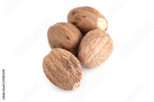 Nutmeg isolated on white background. Close up. photo