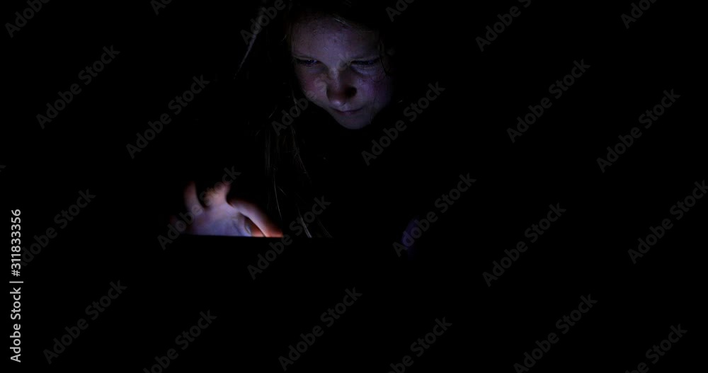 Little girl watching content on her smartphone. The pitfalls of social networks. The child secretly communicates over the Internet at night. Stabilized video. Little girl watching content on her smartphone. The pitfalls of social networks. The child secretly communicates over the Internet at night. Stabilized video.