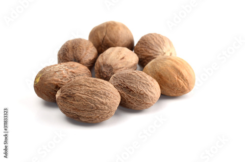 Nutmeg isolated on white background. Close up. photo