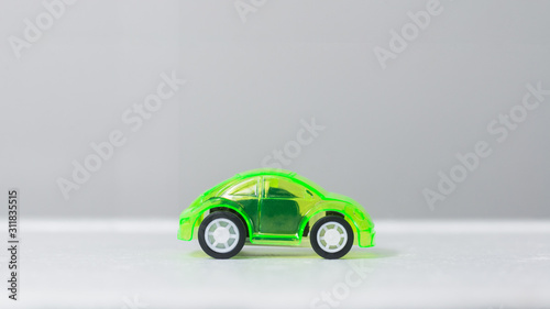 A miniature car on a white background