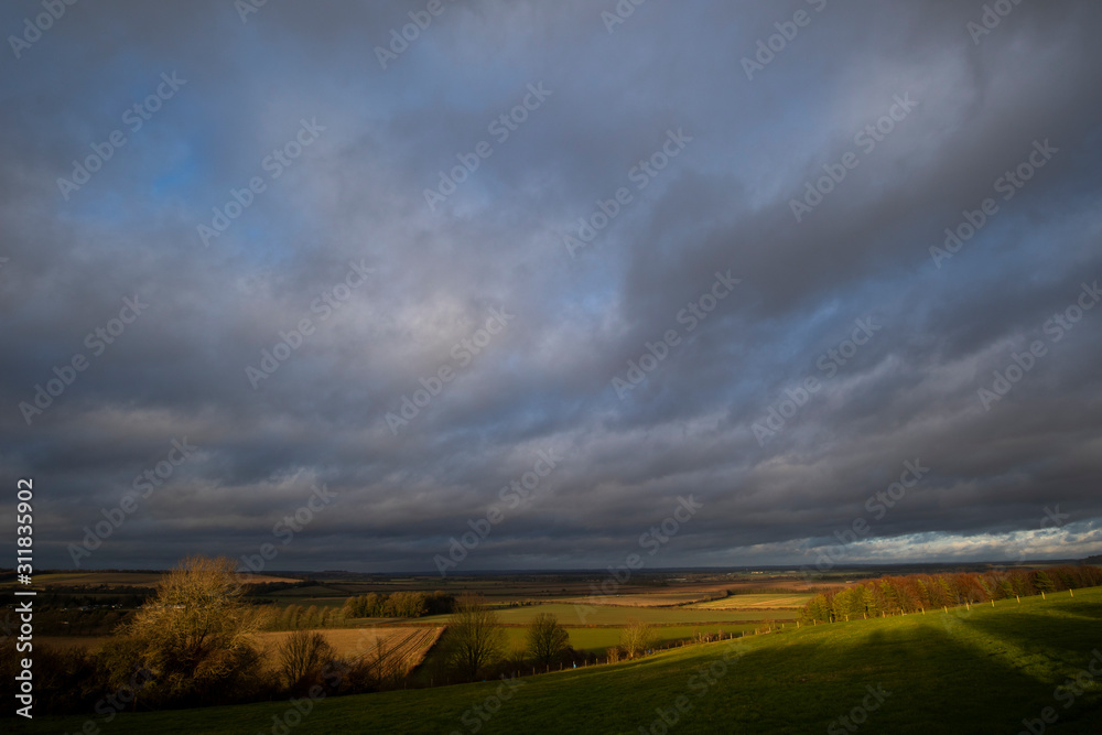 Rain clouds over farmland fields in the rural county of Hampshire Rain clouds over farmland fields in the rural county of Hampshire