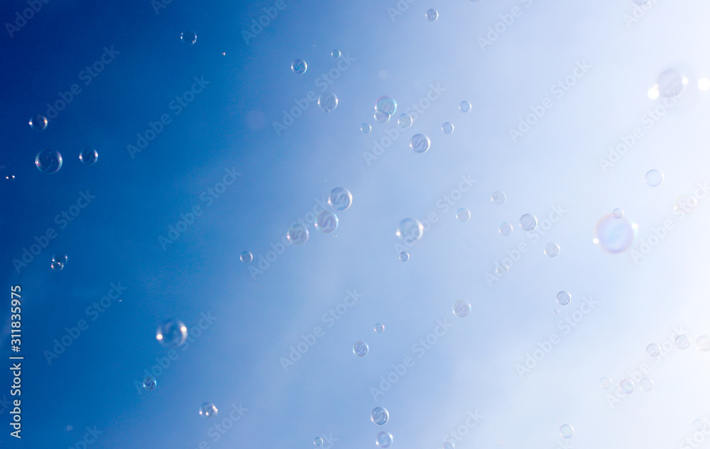 Soap bubbles fly in the blue sky Soap bubbles fly in the blue sky