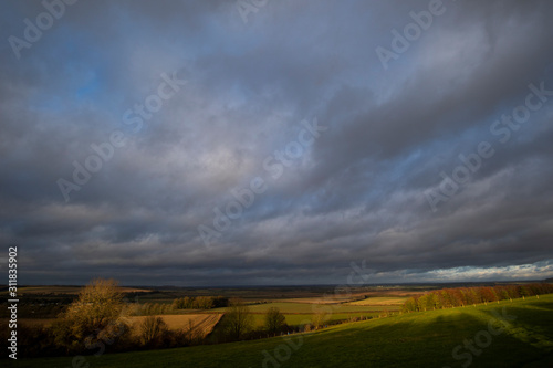 Rain clouds over farmland fields in the rural county of Hampshire