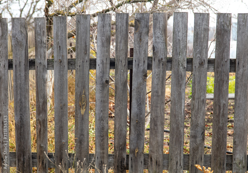 Old wooden boards on the fence as a background Old wooden boards on the fence as a background