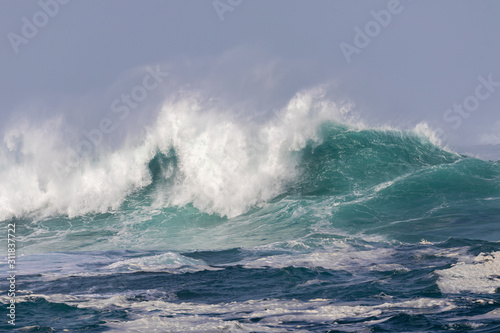 The Atlantic is wild and dangerous. The waves are very high and roll over and spray forms. The Atlantic coast in Galicia in northern Spain. © wewi-creative