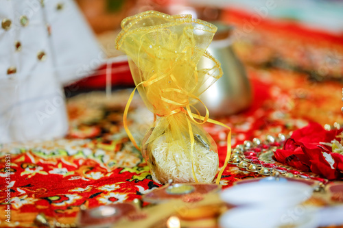Fototapeta Naklejka Na Ścianę i Meble -  Traditional indian wedding ceremony:  coconut in decorative coper kalash 