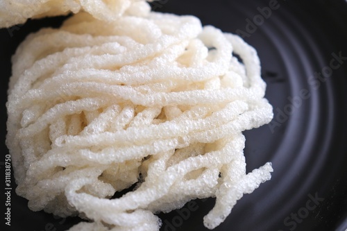 Crunchy fried snack Kurdai. Its a type of fryums which is made using wheat/gehu. selective focus photo