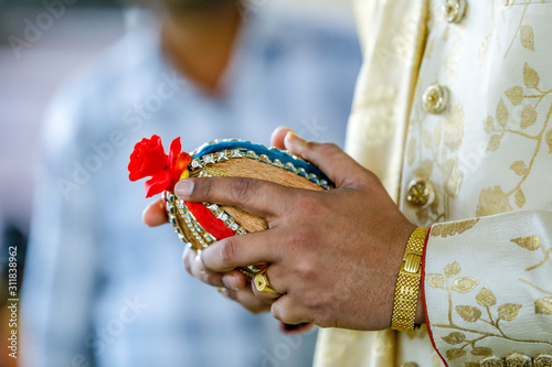 Indian wedding ceremony : Groom hand  © Niks Ads