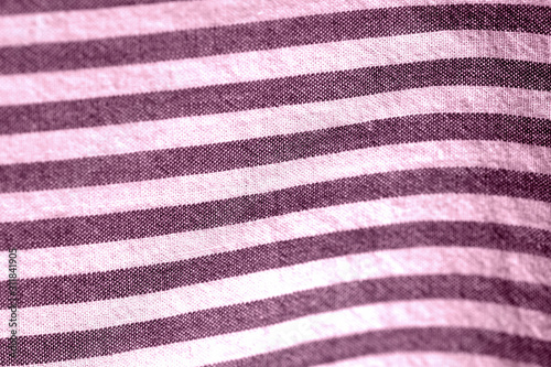Striped textile background close-up. Pink color toned