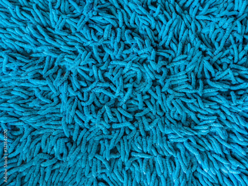 Doormat background & texture. Blue doormat background. close-up blue cleaning doormat or carpet texture.