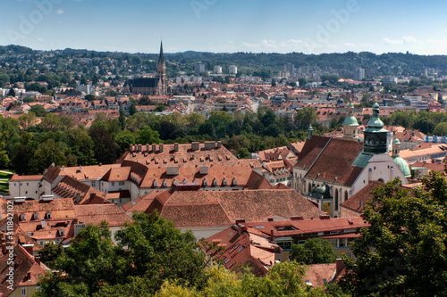 Aerial View Of Graz City Center. Graz Cathedral, Mausoleum, Heart Of Jesus Church. Tiled roofs of old city buildings