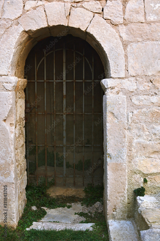 Entrance with iron bars.