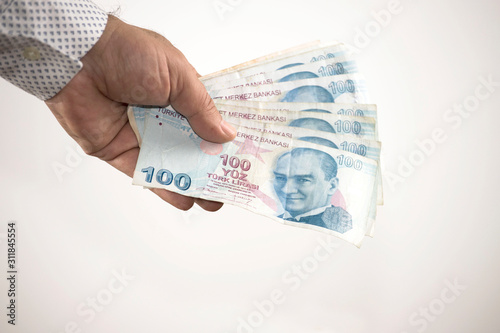 The man is counting turkish lira banknote photo