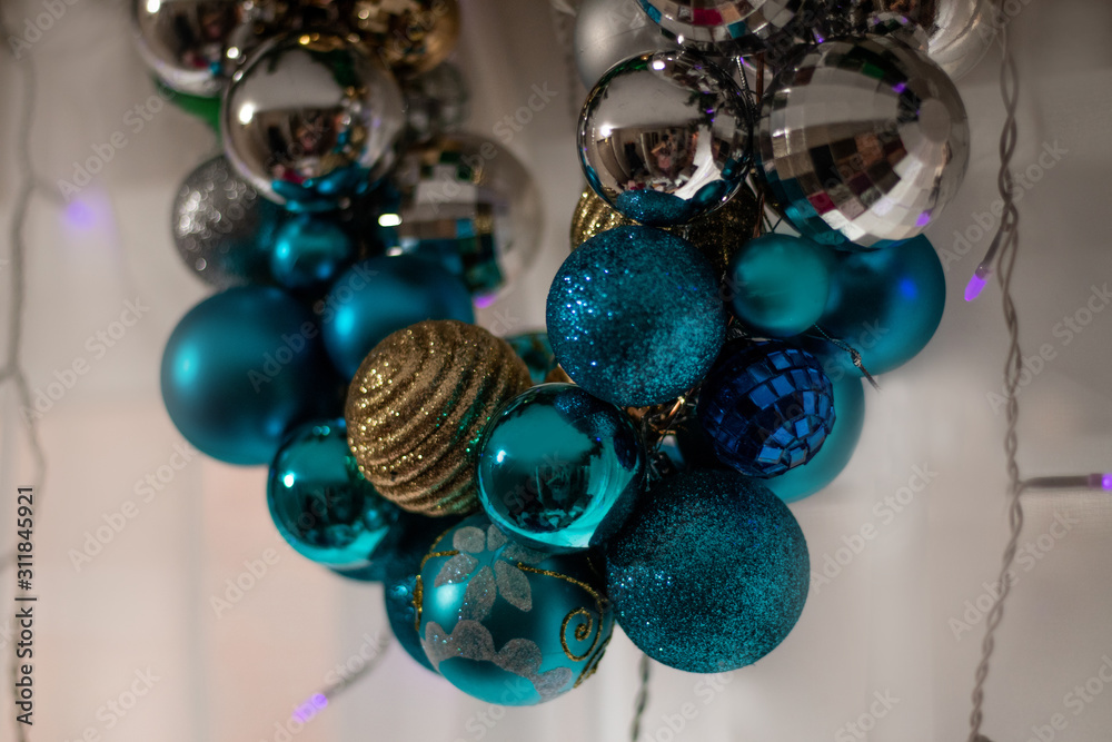 Christmas wreath. Blue, gold, silver christmas balls with green ribbon. Christmas decoration. Christmas tree toys. Christmas spruce branches with garlands. Christmas wreath. Blue, gold, silver christmas balls with green ribbon. Christmas decoration. Christmas tree toys. Christmas spruce branches with garlands.