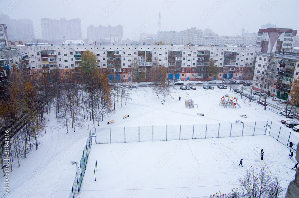 Fototapeta premium Surgut in winter. City view. Typical Soviet buildings. Polar day.