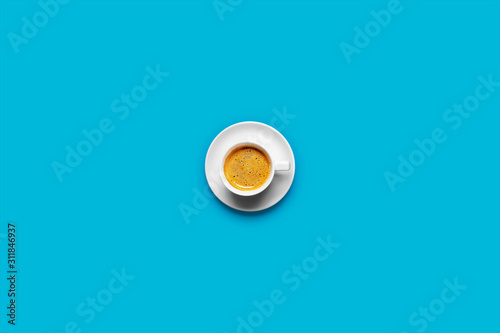 Black coffee in a cup on a blue background