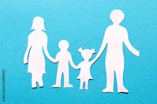 Family paper chain cutout holding hands on the blue background