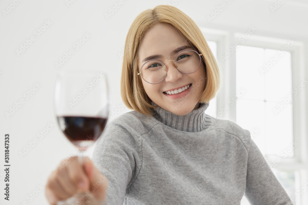 business women with red wine glasses in hand business women with red wine glasses in hand