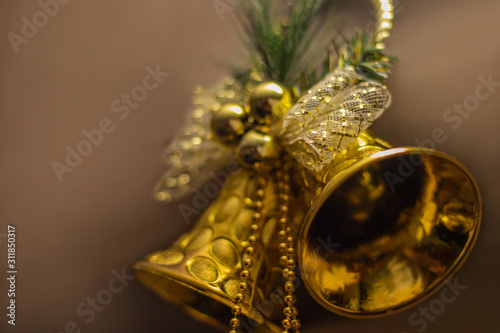 Christmas golden bell, golden beads, spruce branch, Christmas decoration.