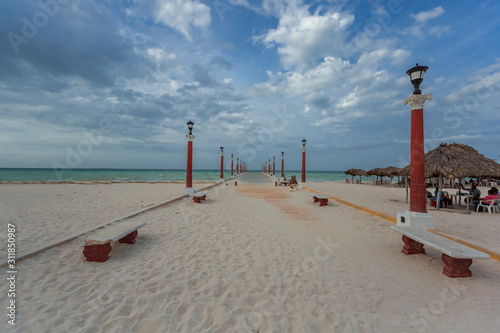 sisal pier covered with snad beach photo