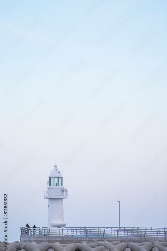 lighthouse. A lighthouse on the coast. A lighthouse on a breakwater. Lighthouse and Tetrapod. lighthouse. A lighthouse on the coast. A lighthouse on a breakwater. Lighthouse and Tetrapod.