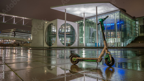 Dockless electric scooters parked in the face of Paul Löbe Haus, Berlin photo