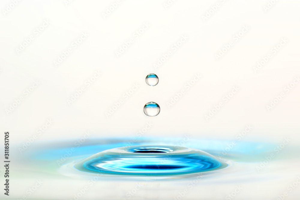 two blue bright waterdrops on a white background two blue bright waterdrops on a white background