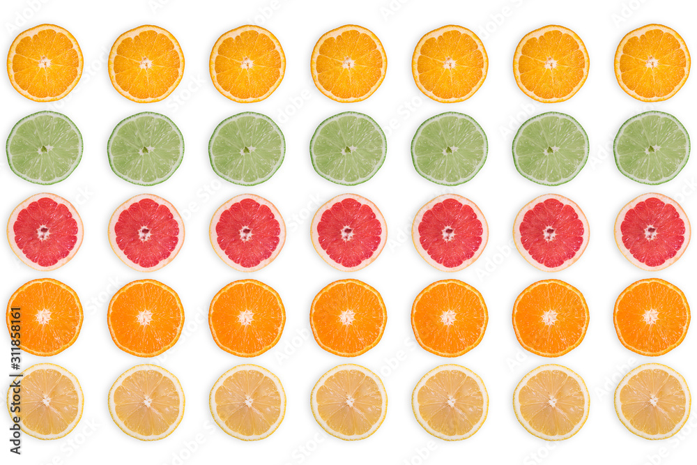 multi-colored citrus slices on a white background multi-colored citrus slices on a white background