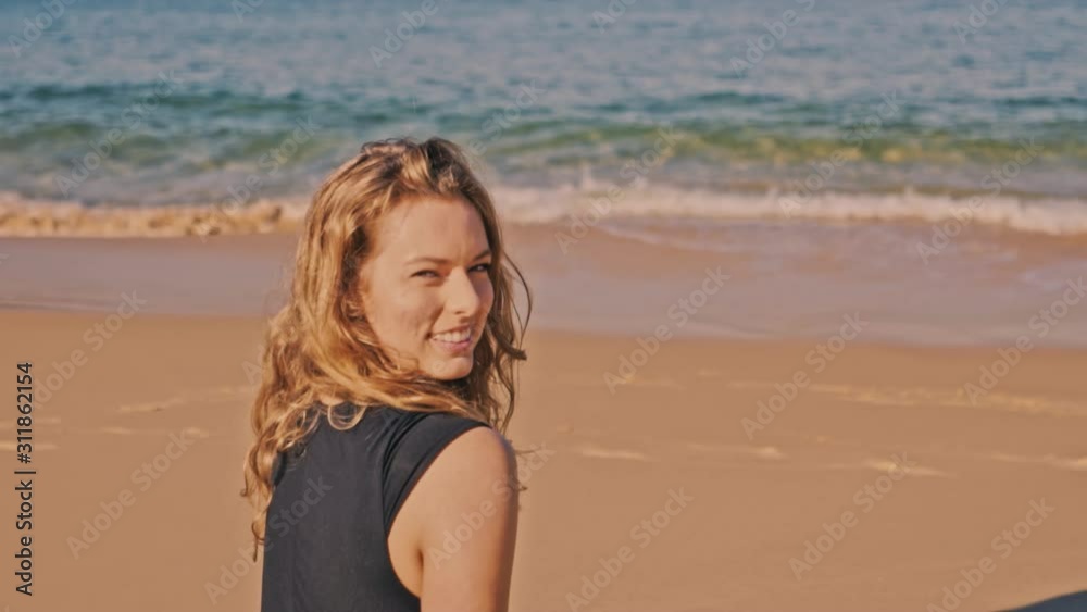 Happy brunette lady smiling on beach with ocean background, Circle shot Happy brunette lady smiling on beach with ocean background, Circle shot