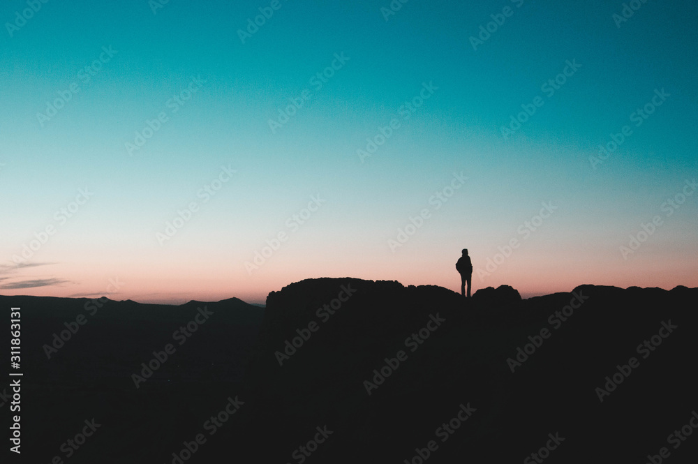 Silhouette of a man at a cliff in Cappadocia