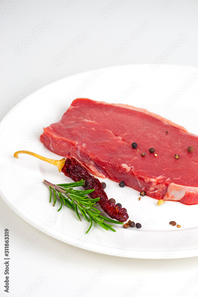 raw beef steak with red pepper raw beef steak with red pepper