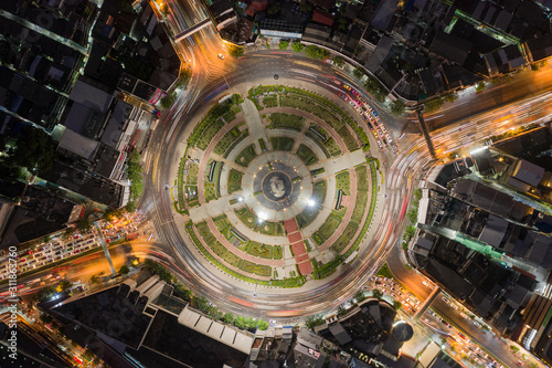 Road roundabout with car lots Wongwian Yai in Bangkok,Thailand. street large beautiful downtown at night light. Aerial view , Top view ,cityscape ,Rush hour traffic jam © Sathit Trakunpunlert