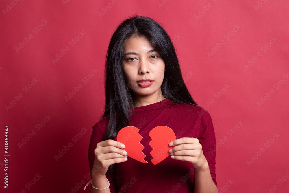 Beautiful young Asian woman with broken heart. Beautiful young Asian woman with broken heart.