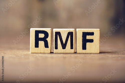 Text RMF on wood block , business concept.