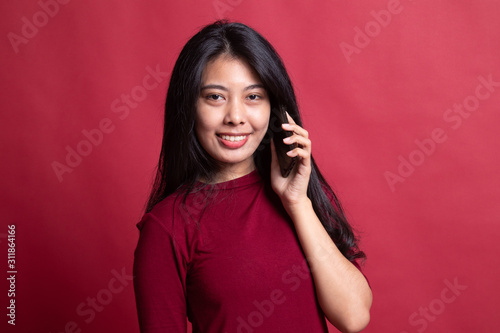 Young Asian woman talking with mobile phone.