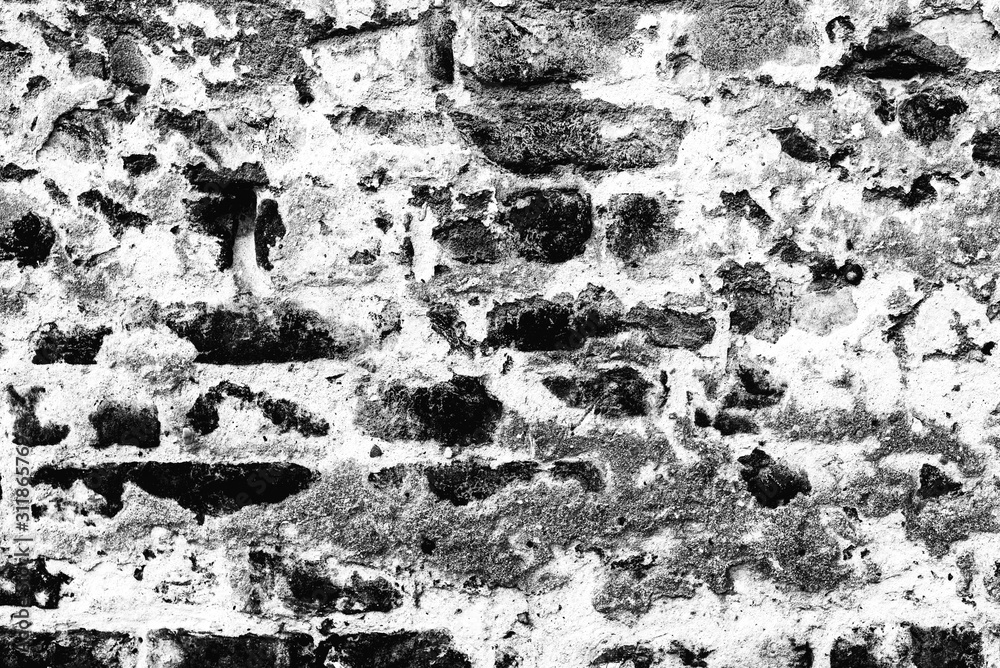 Obraz premium Texture of a brick wall with cracks and scratches which can be used as a background