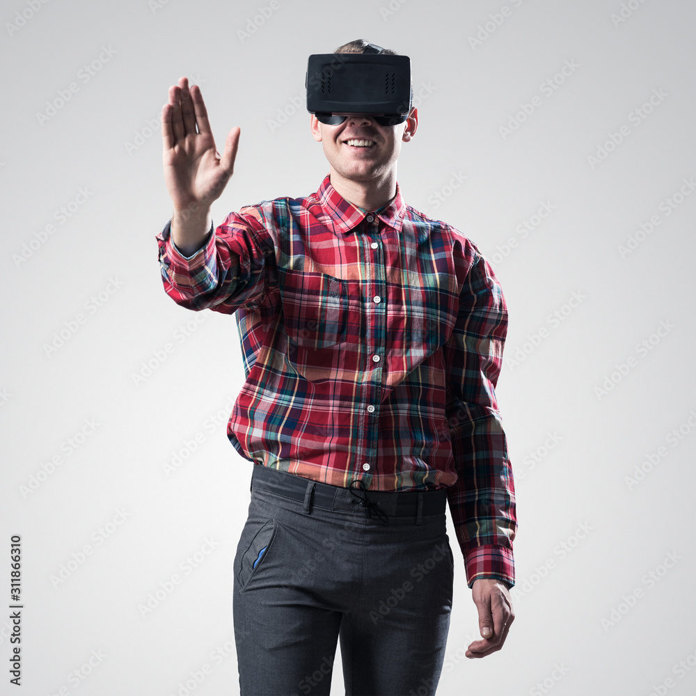 Guy in mask experiencing virtual reality as new entertainment device Guy in mask experiencing virtual reality as new entertainment device