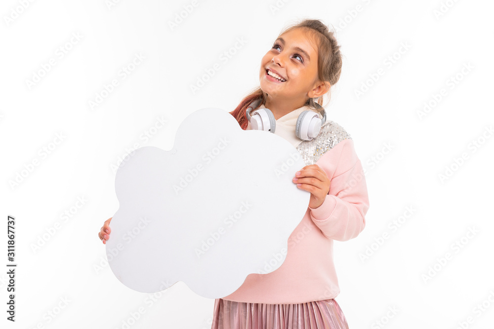 Little beautiful girl with brown hair holds a white card and smiles Little beautiful girl with brown hair holds a white card and smiles