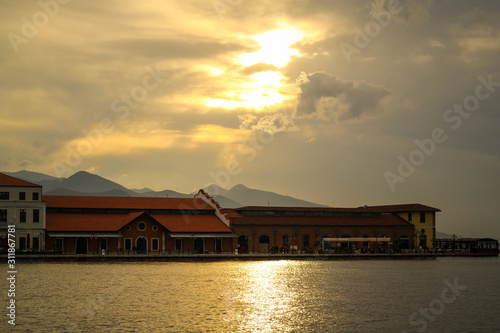 Historical harbour in Izmir, Turkey at sunset in the sea shore. Sea towns view concept. 